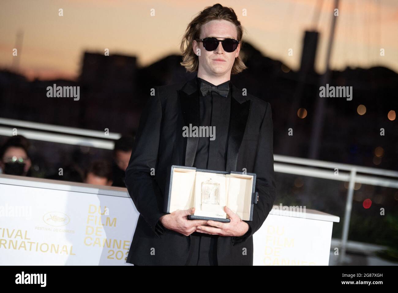 Caleb Landry Jones poses with the Best Actor Award for Nitram during the 74th annual Cannes Film Festival on July 17, 2021 in Cannes, France. Photo by David Niviere/ABACAPRESS.COM Stock Photo