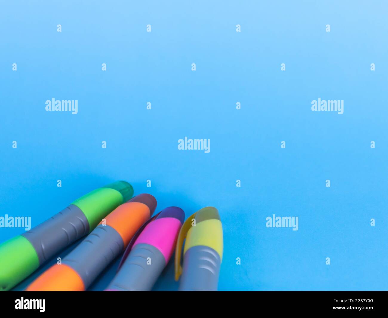 Coloring markers on a blue light background. Copyspace Stock Photo Alamy