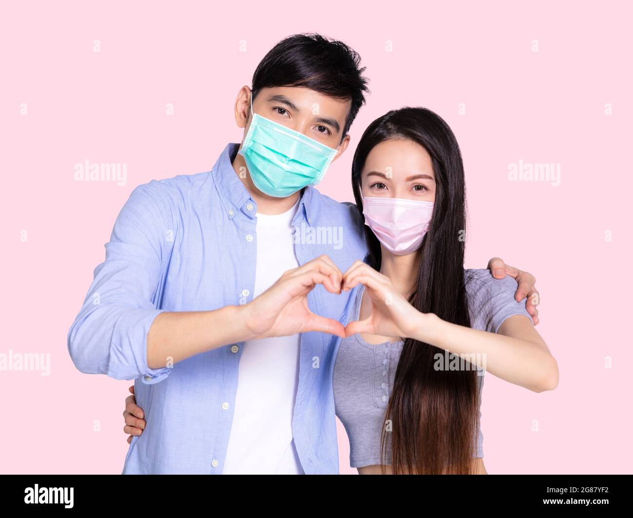 Youve Taught Me The True Meaning Of Love. A Couple Forming A Heart Shape  With Their Hands While Sitting On The Beach. Stock Photo, Picture and  Royalty Free Image. Image 198911221.