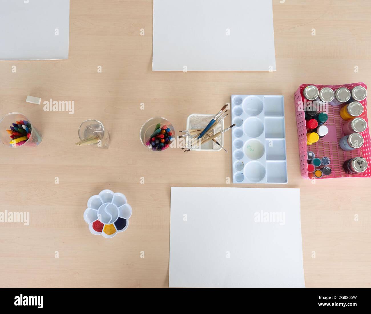 Top view of drawing and painting supplies prepared for elementary school art classrooms. Stock Photo
