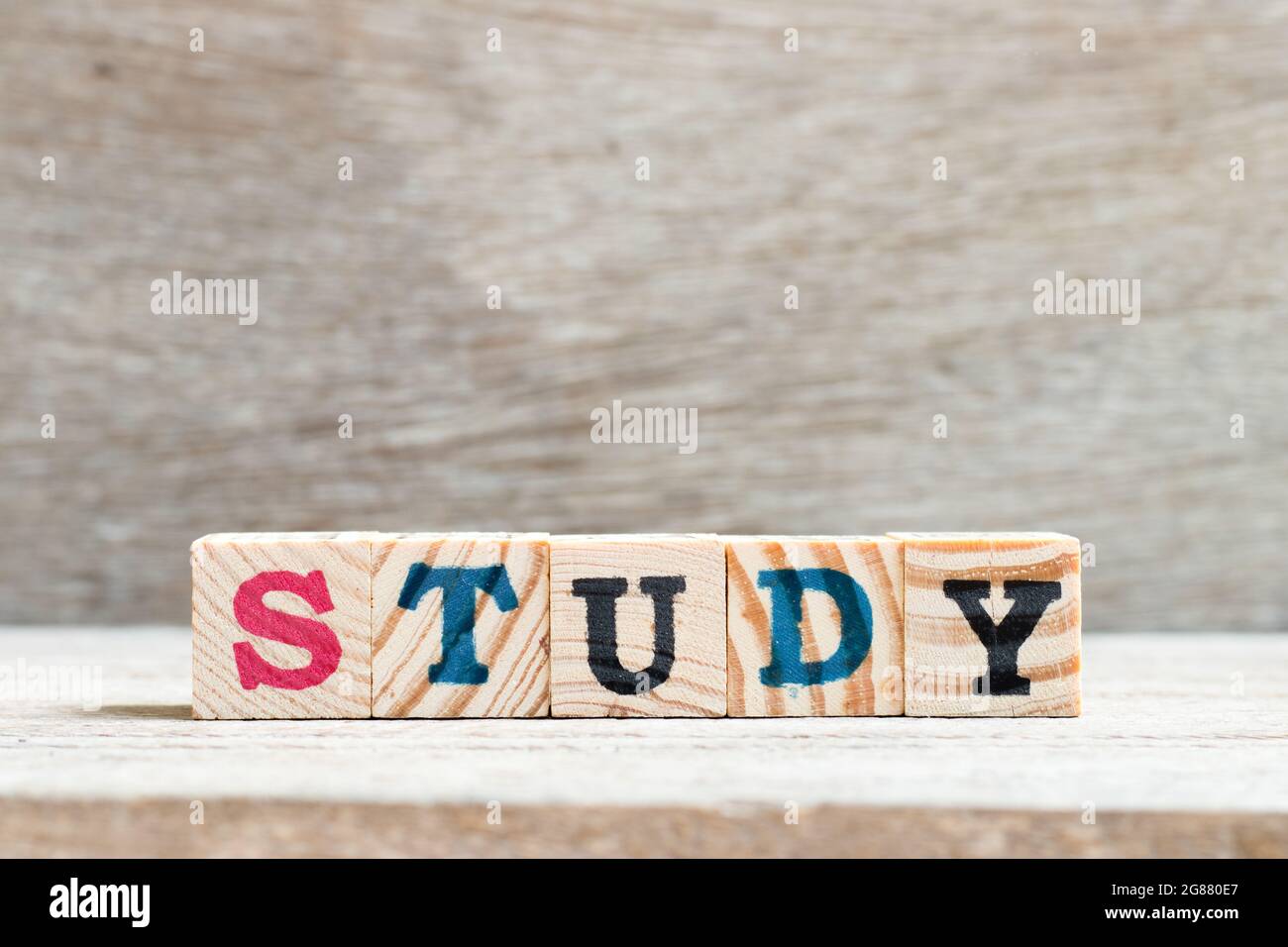 Letter block in word study on wood background Stock Photo