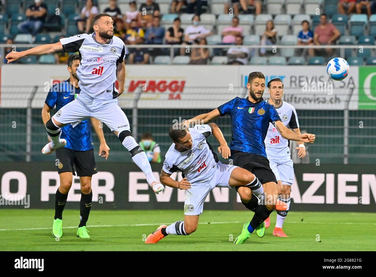 Roberto Gagliardini (#5 FC Inter) and Reto Ziegler (#3 FC Lugano) during  the Friendly match between FC Lugano and FC Internazionale at Cornaredo  Stadium in Lugano, Switzerland Stock Photo - Alamy