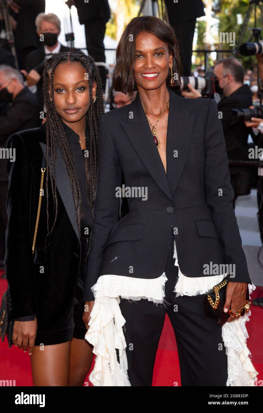 Liya Kebede (r) and daughter Raee Kebede attend the closing night premiere of 'OSS 117: From Africa with Love' during the 74th Annual Cannes Film Festival at Palais des Festivals in Cannes, France, on 17 July 2021. Stock Photo