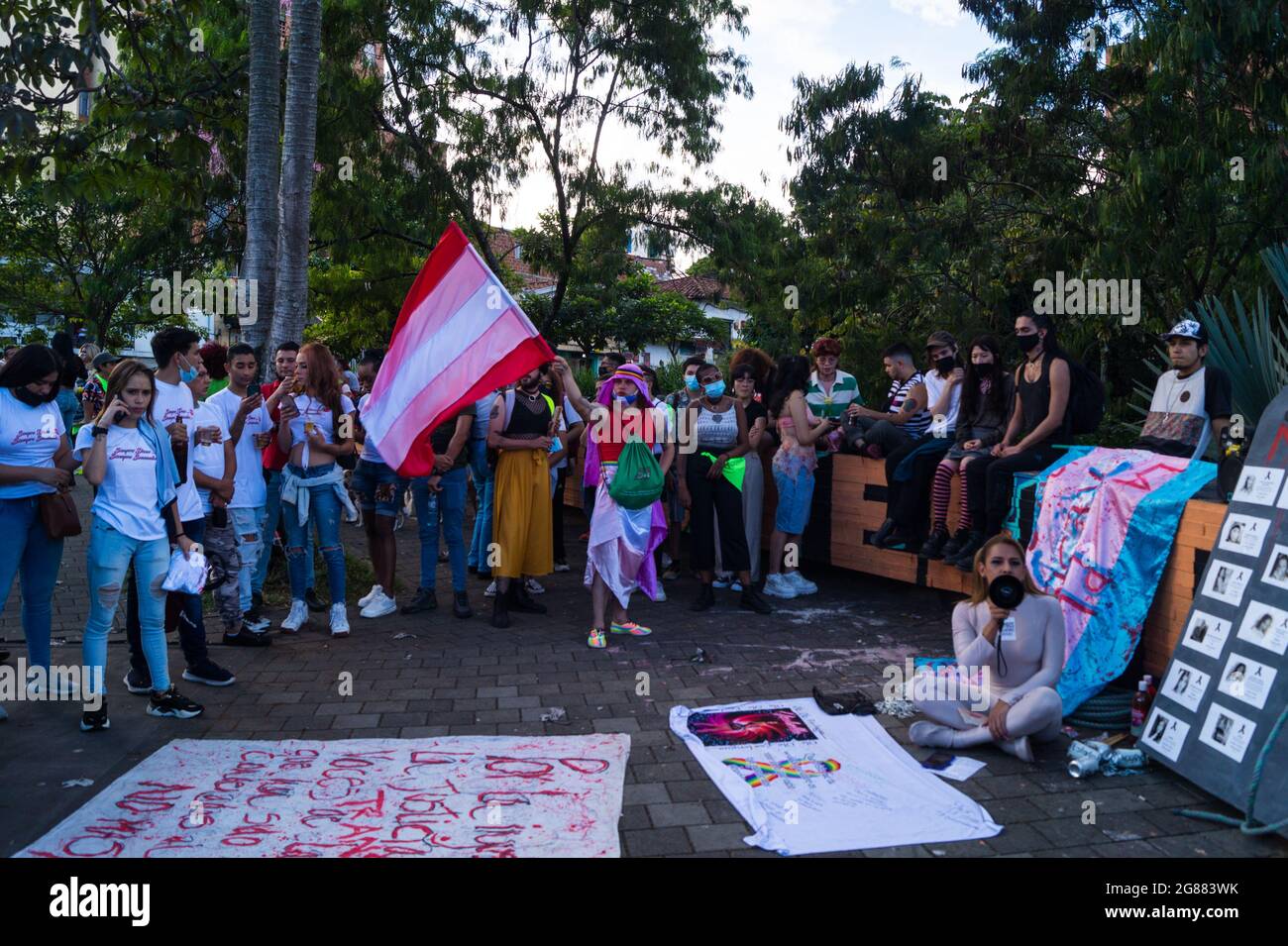 Bogota, Colombia. 16th July, 2021. Trans community members wave their flag with red lines to simbolize the crimes commited to them during the anual 'Yo Marcho Trans' protest where Transgender females and males protest for the right to live, equalities and to stop crimes against the community in Medellin, Antioquia - Colombia on July 16, 2021. Credit: Long Visual Press/Alamy Live News Stock Photo