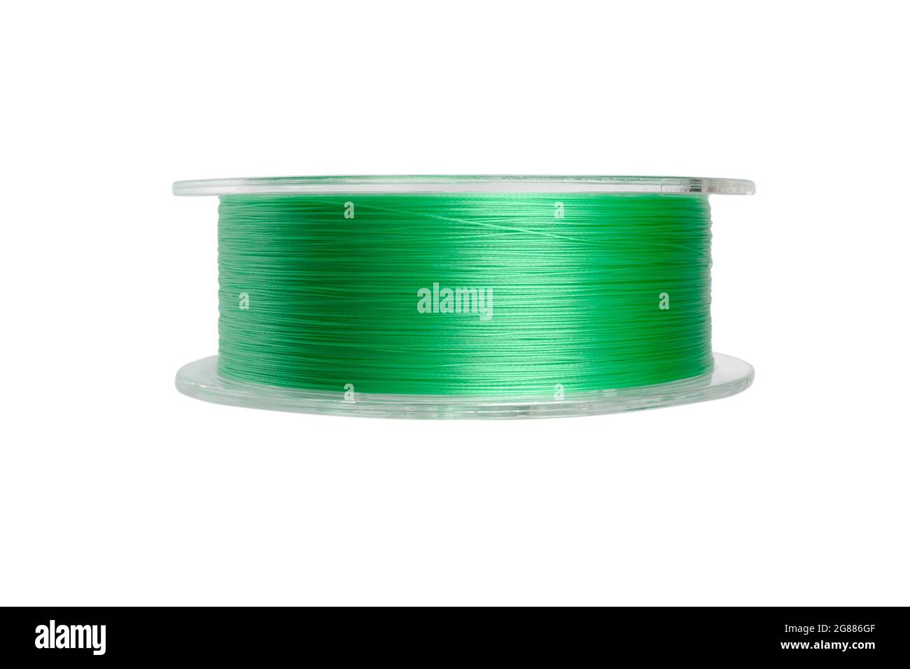 Fishing braided line isolated on white background. Spool of green cord
