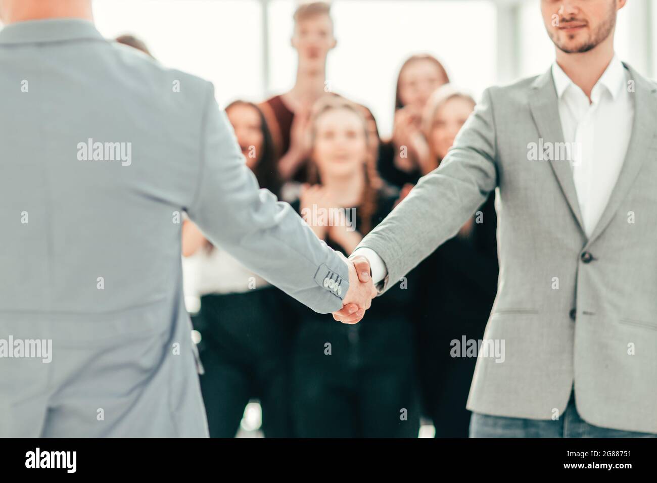 close up. young people confidently shaking hands Stock Photo