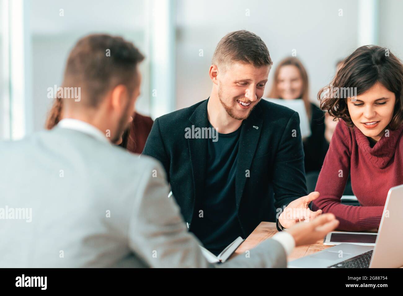 serious group of employees discussing working issues . Stock Photo