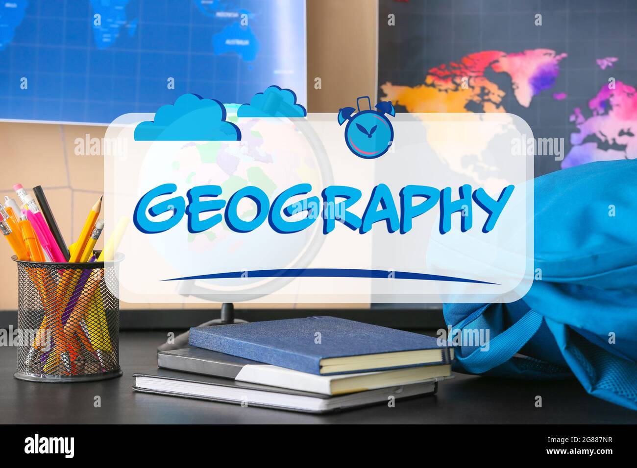 Books with schoolbag, stationery and globe in classroom at geography lesson Stock Photo Alamy