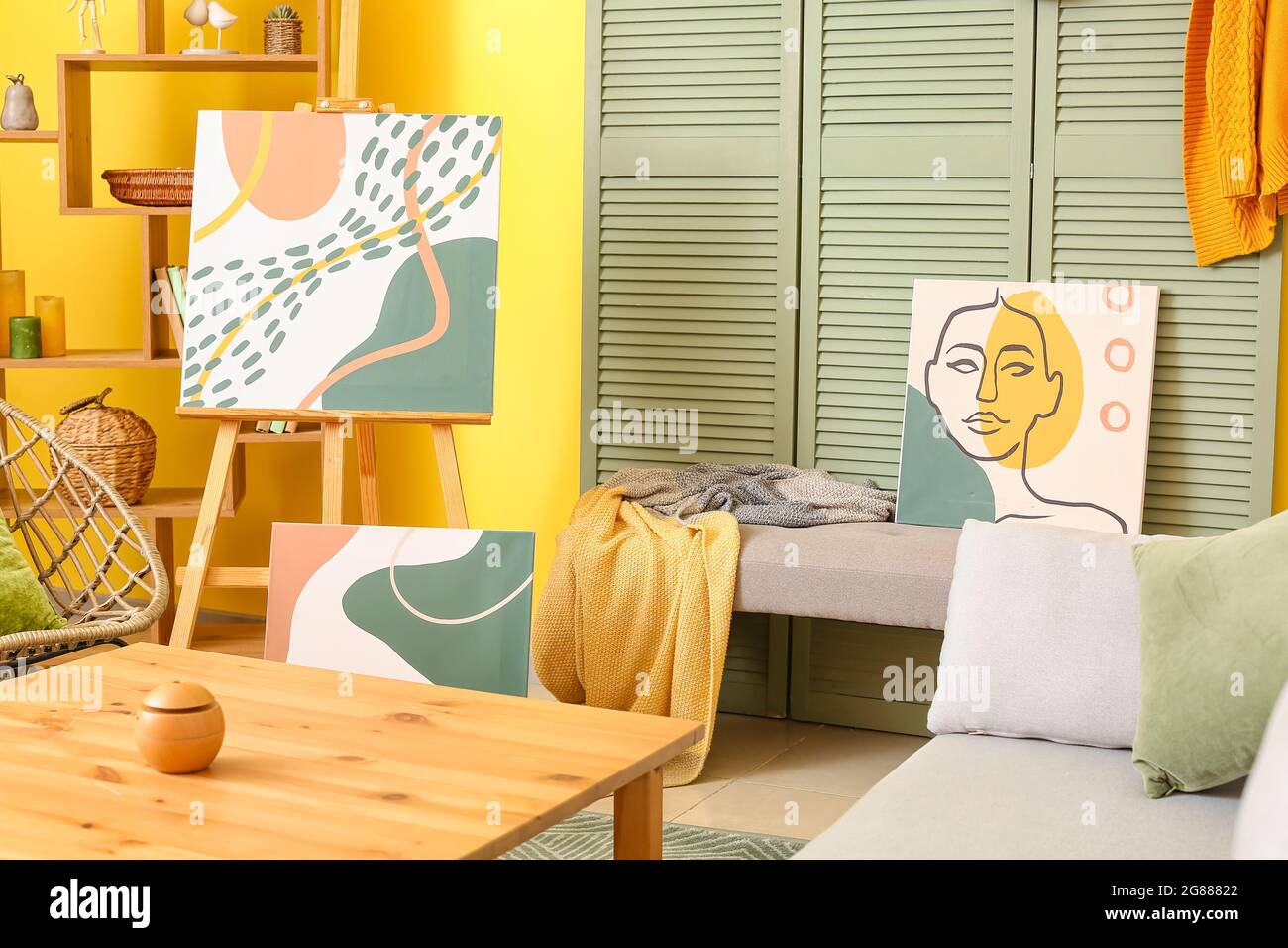 Interior of stylish living room with pictures Stock Photo - Alamy
