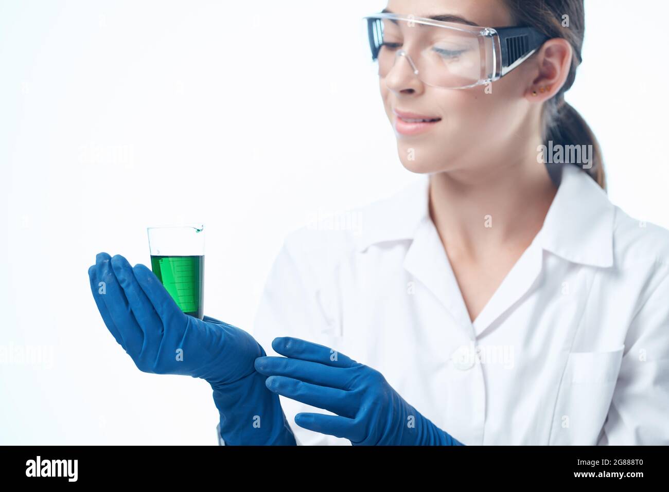 female laboratory assistant chemical solution research biotechnology