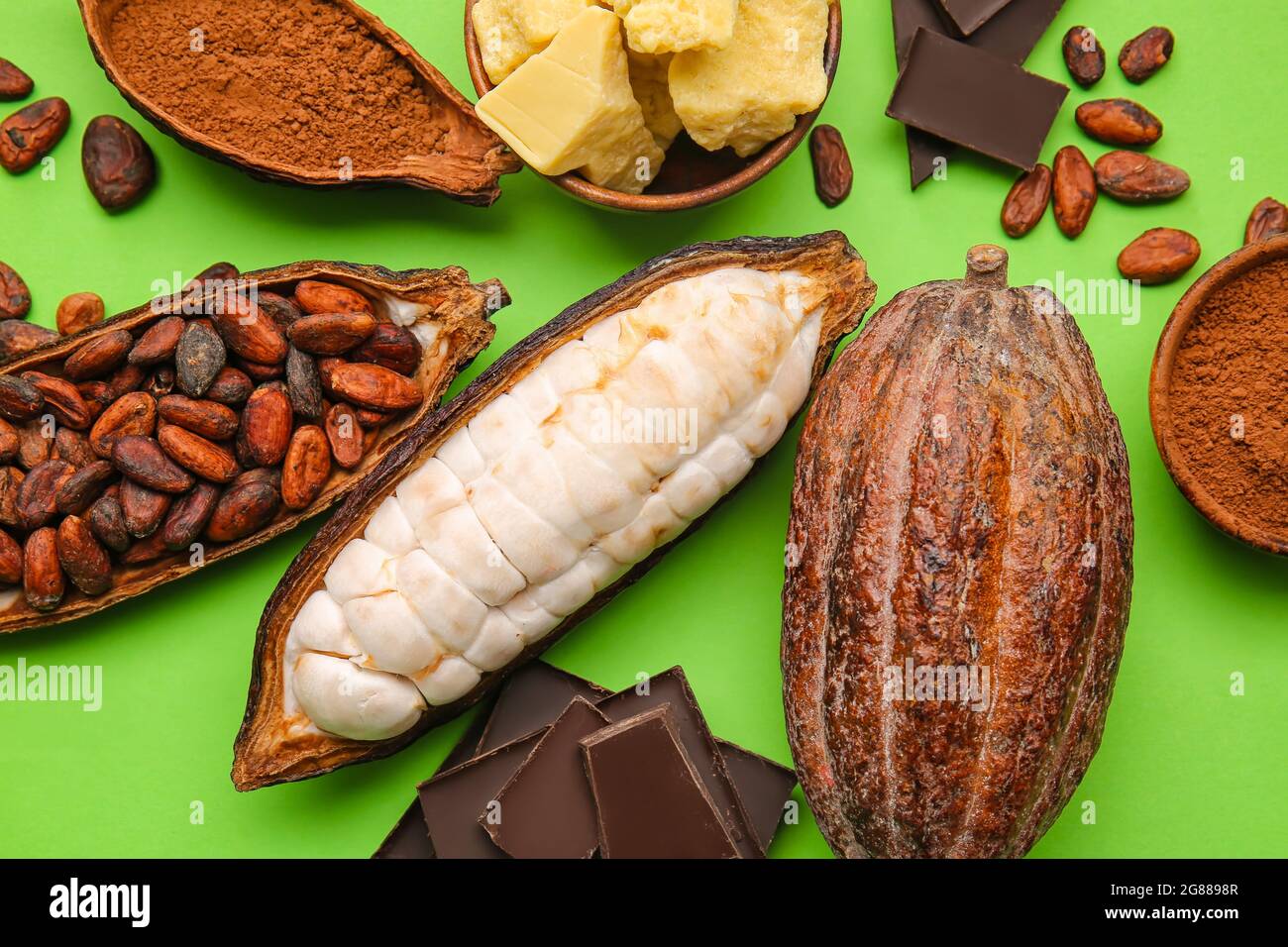 Fresh cocoa fruits, beans, powder, butter and chocolate on color background  Stock Photo - Alamy