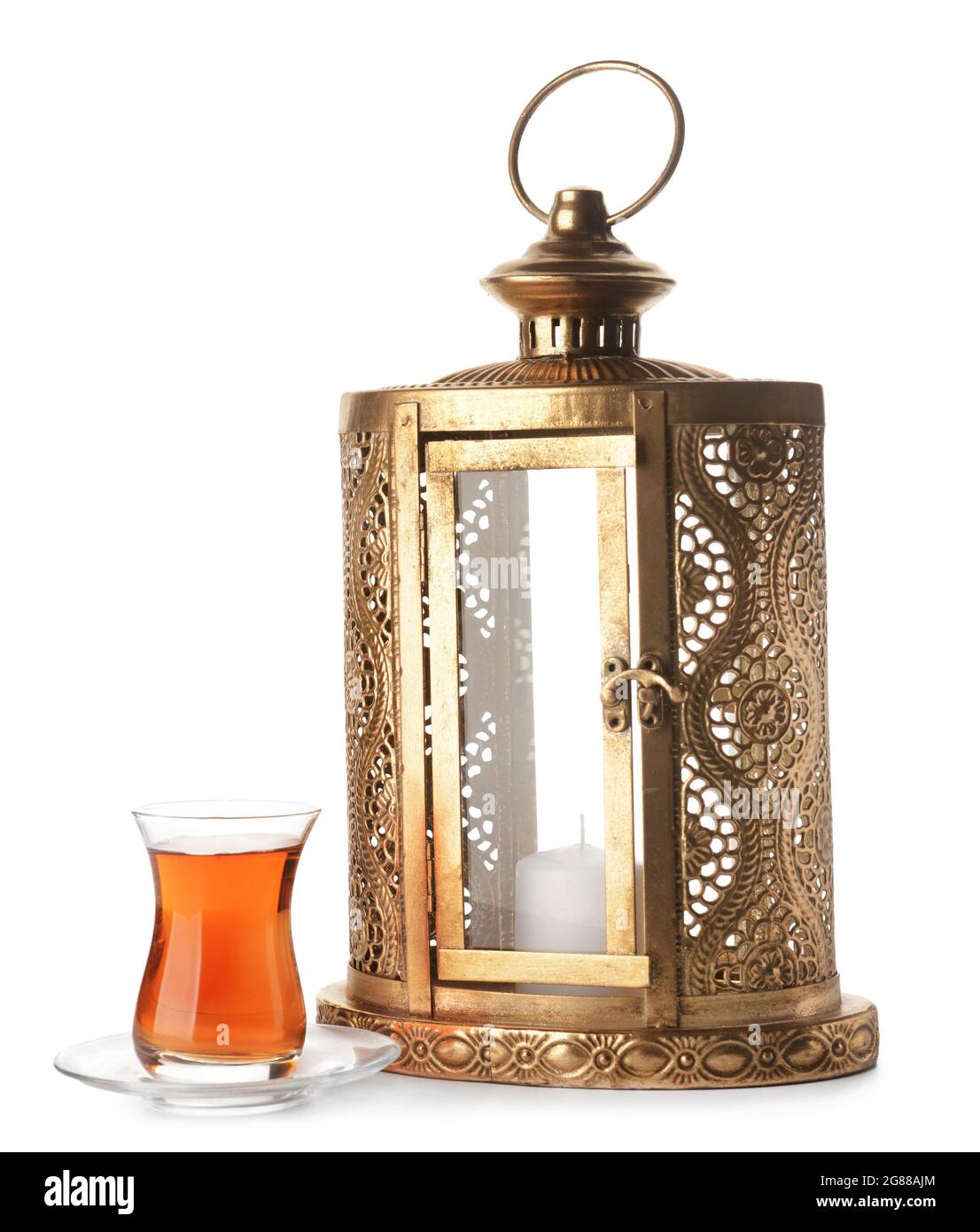 Muslim lantern with Turkish tea on white background Stock Photo