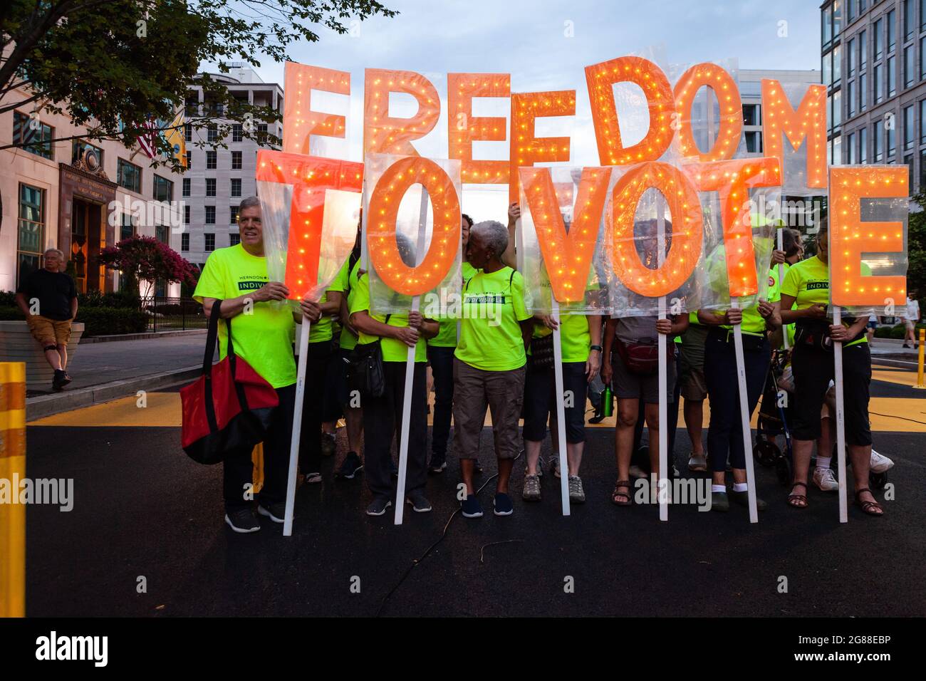 Washington, DC, USA, 17 July 2021.  Pictured: Signs supporting the freedom to vote at the DC Good Trouble Vigil for Democracy on the first anniversary of the death of voting and civil rights icon John Lewis.  DC Vote, Common Cause, and 9 other organizations sponsored the vigil to honor Lewis and urge Congress to pass the voting rights act that bears his name.   Credit: Allison Bailey / Alamy Live News. Stock Photo