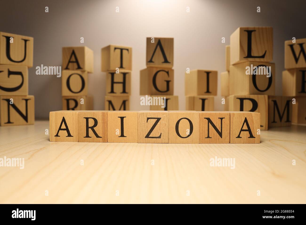 The word Arizona was created from wooden letter cubes. Cities and words