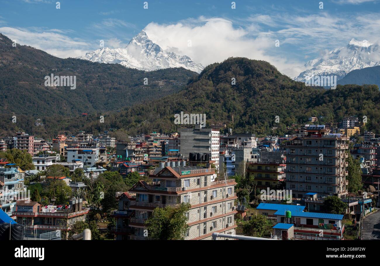 The cityscape of Pokhara with the Annapurna mountain range covered in snow at central Nepal, Asia Stock Photo