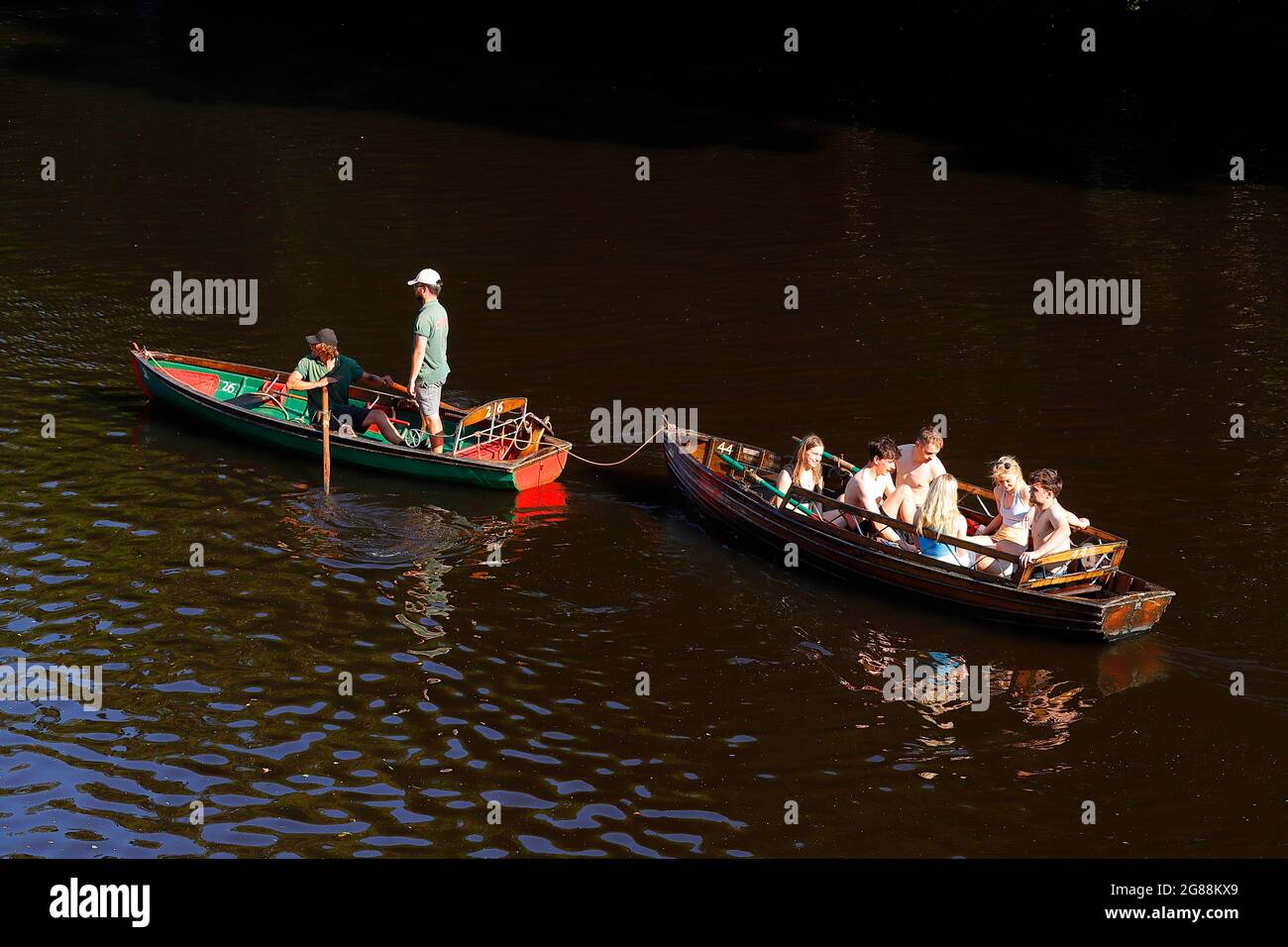 A rowing boat being towed by safety marshalls in Knaresborough,North
