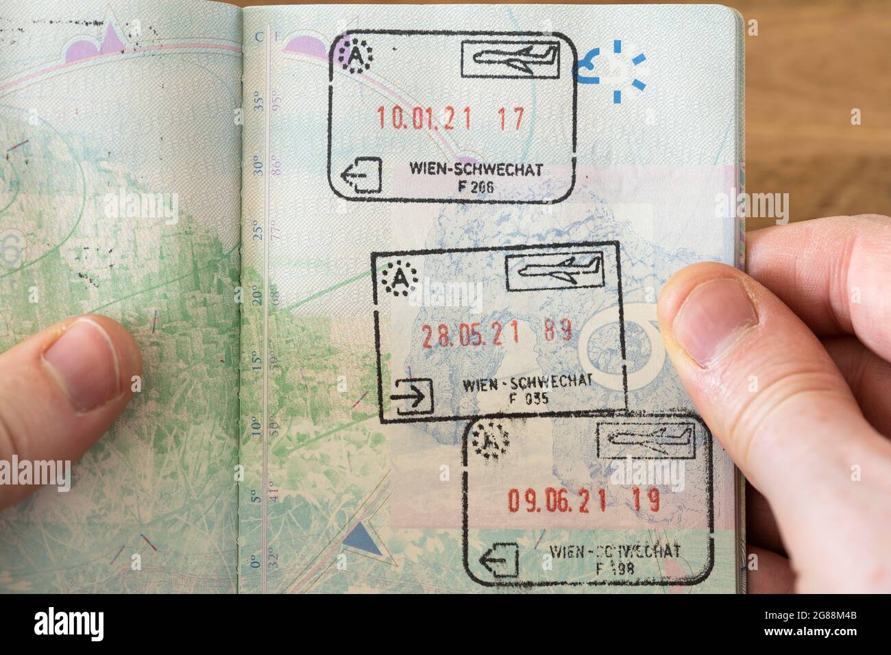 Austrian entry and exit visa stamps in a UK passport in 2021 following the United Kingdom leaving the EU Schengen Area and becoming a third country Stock Photo