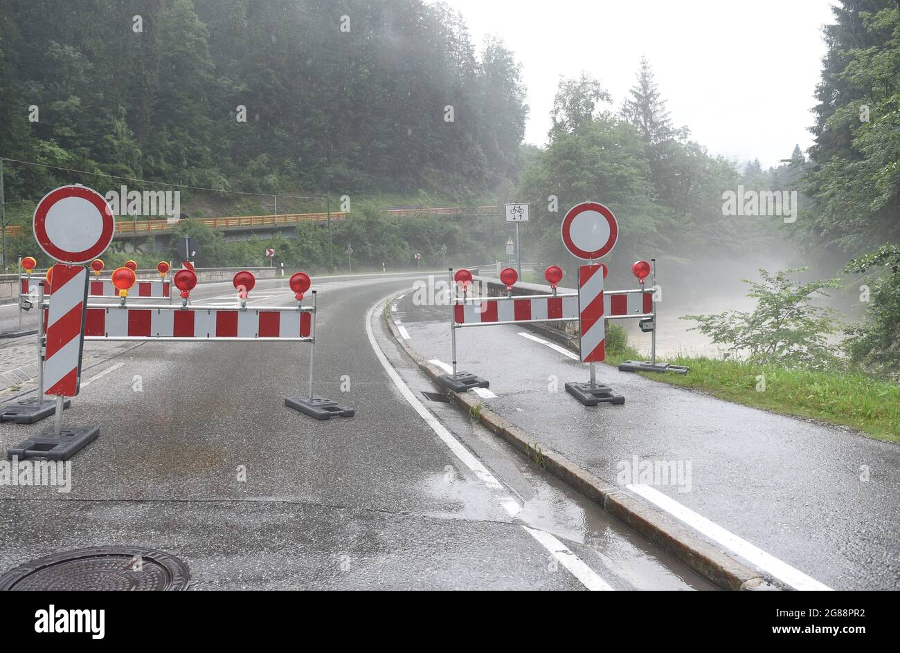 18 July 2021, Bavaria, Königssee: The road towards Königssee is closed in the Berchtesgadener Land in Bavaria due to thunderstorms and high water. Photo: Felix Hörhager/dpa Stock Photo