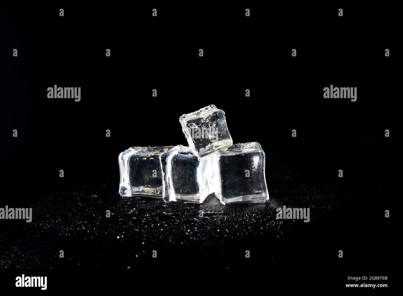 5 wet artificial or fake ice cube at Black background Stock Photo Alamy