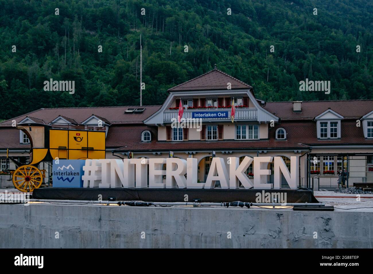 Interlaken Ost train station Building (Interlaken Zollhaus) with green