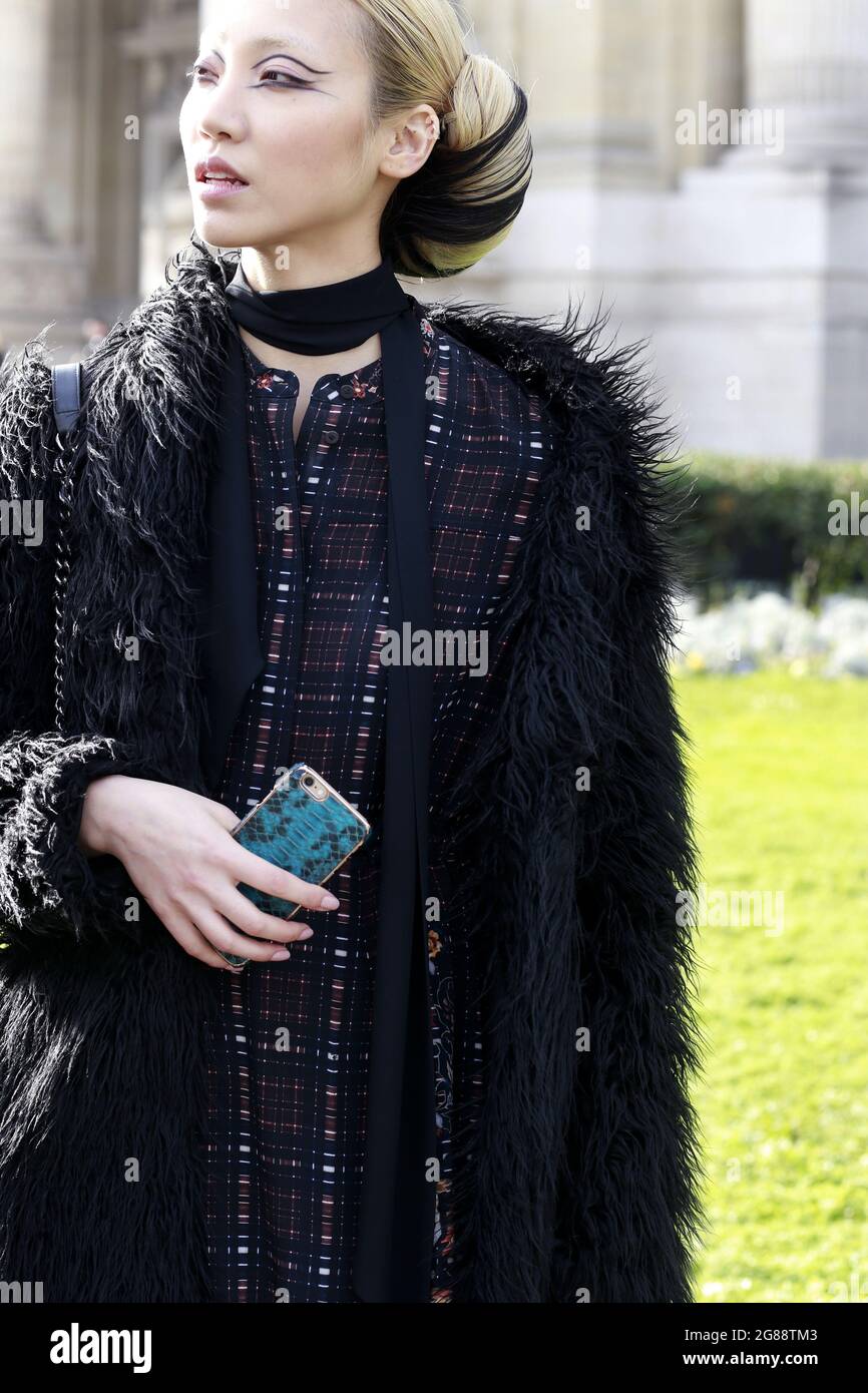 Model Soo Joo Park wears a Archive vintage coat, All Saints dress on day 3  of Paris Haute Couture Fashion Week Spring/Summer 2016, on January 26, 2015  Stock Photo - Alamy