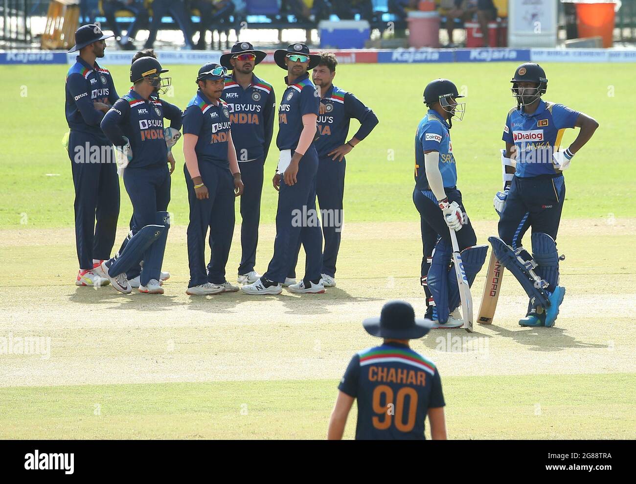 Colombo, Sri Lanka. 18th July, 2021. India's cricketers wait for third umpire's decision for the dismissal of Sri Lanka's Bhanuka Rajapaksa during the first one-day international (ODI) cricket match between Sri Lanka and India at the R.Premadasa Stadium in Colombo on July 18, 2021. (Credit Image: © Pradeep Dambarage/ZUMA Press Wire) Stock Photo