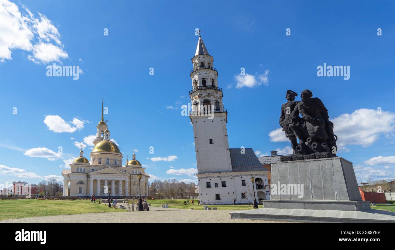 Leaning Tower of Nevyansk, Old Believers' church (domed) and monument to Peter the Great and Nikita Demidov in summer day. Stock Photo