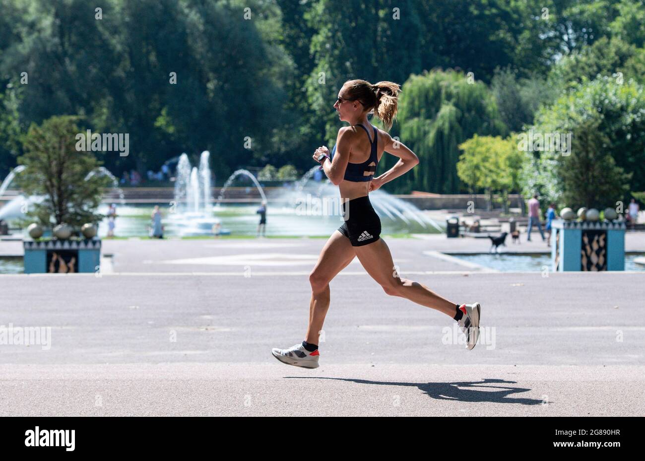 Battersea Park, United Kingdom. 18 July, 2021. Stephanie Davis Team GB Olympic Marathon runner trains in the sweltering heat at Battersea Park in preparation for the heat at the 2020 Tokyo Olympic Games. Credit: Nigel Bramley/Alamy Live News Stock Photo