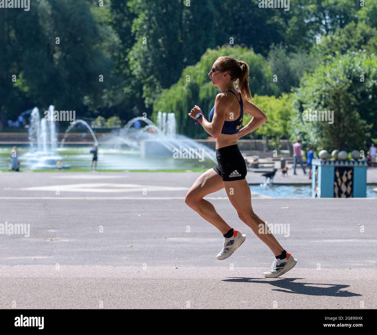 Battersea Park, United Kingdom. 18 July, 2021. Stephanie Davis Team GB Olympic Marathon runner trains in the sweltering heat at Battersea Park in preparation for the heat at the 2020 Tokyo Olympic Games. Credit: Nigel Bramley/Alamy Live News Stock Photo