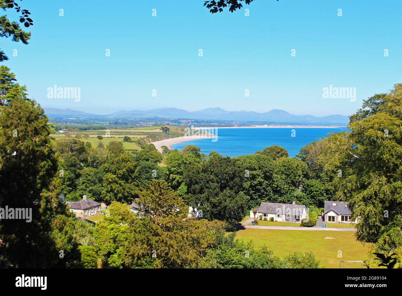 Views, landscape and scenery of Llandbedrog beach and countryside with blue sky in Llanbedrog, North Wales Stock Photo