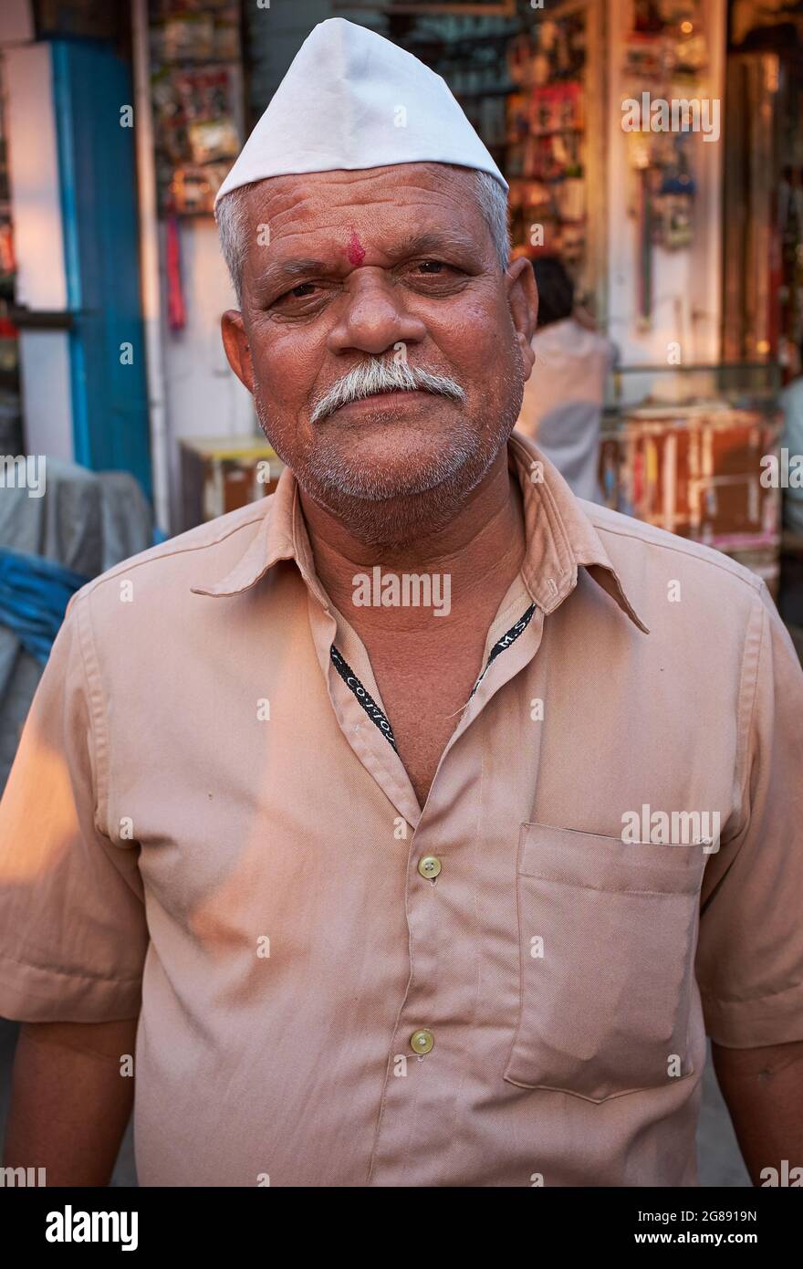 An ethnic Maharashtrian man with traditional Gandhi or Nehru cap, often worn by Maharashtrian men; Mumbai, Maharashtra, India Stock Photo