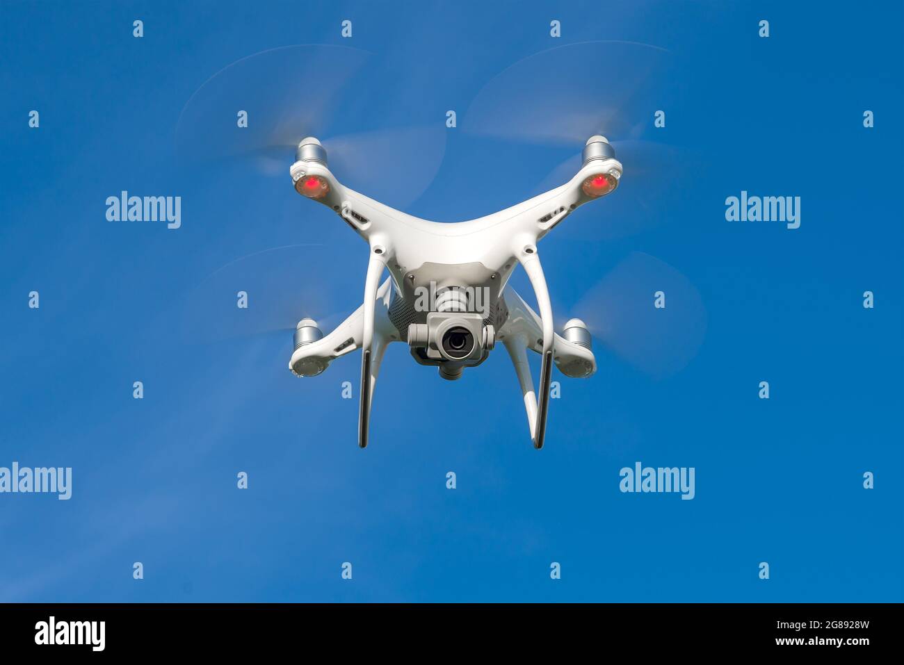 Flying quadcopter with downward facing camera close-up Stock Photo