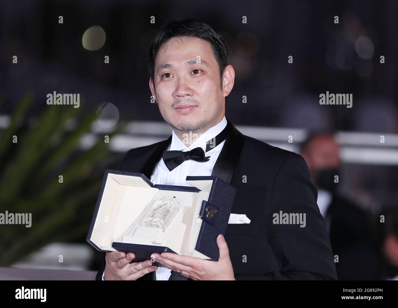 Cannes, France. 17th July, 2021. Ryusuke Hamaguchi, winner of the award for best screenplay for the film 'Drive My Car', poses during a photocall at the 74th Cannes Film Festival in Cannes, France, July 17, 2021. The 74th Cannes Film Festival concluded here on Saturday. Credit: Gao Jing/Xinhua/Alamy Live News Stock Photo