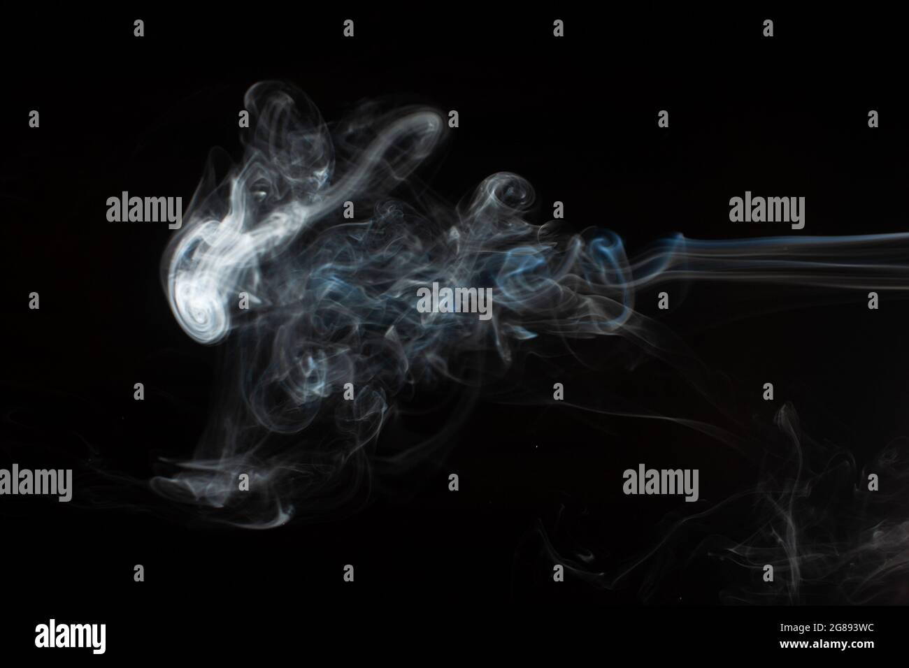 Abstract smoke isolated on black. White smoke on a black background ...
