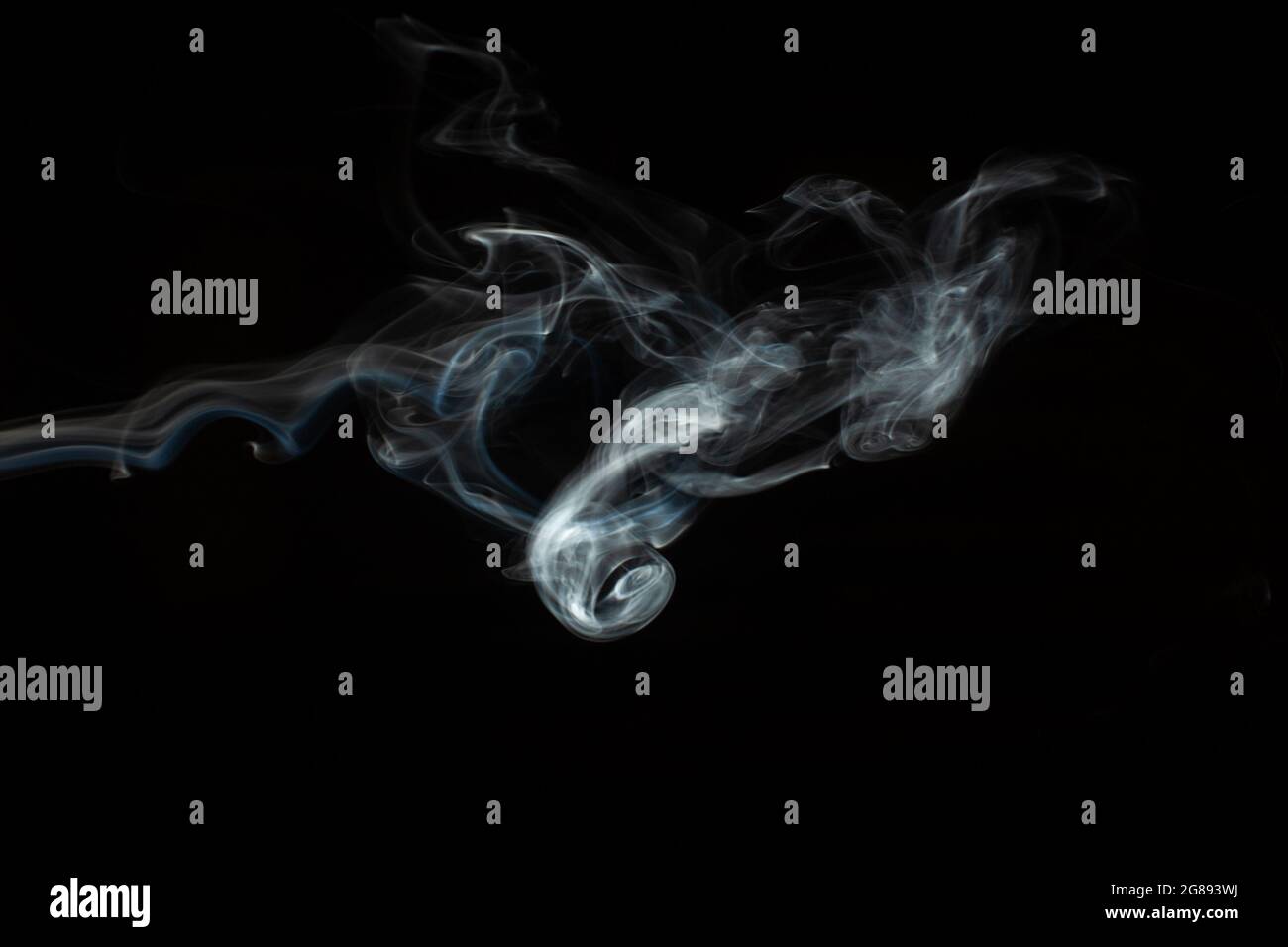 Abstract smoke isolated on black. White smoke on a black background ...