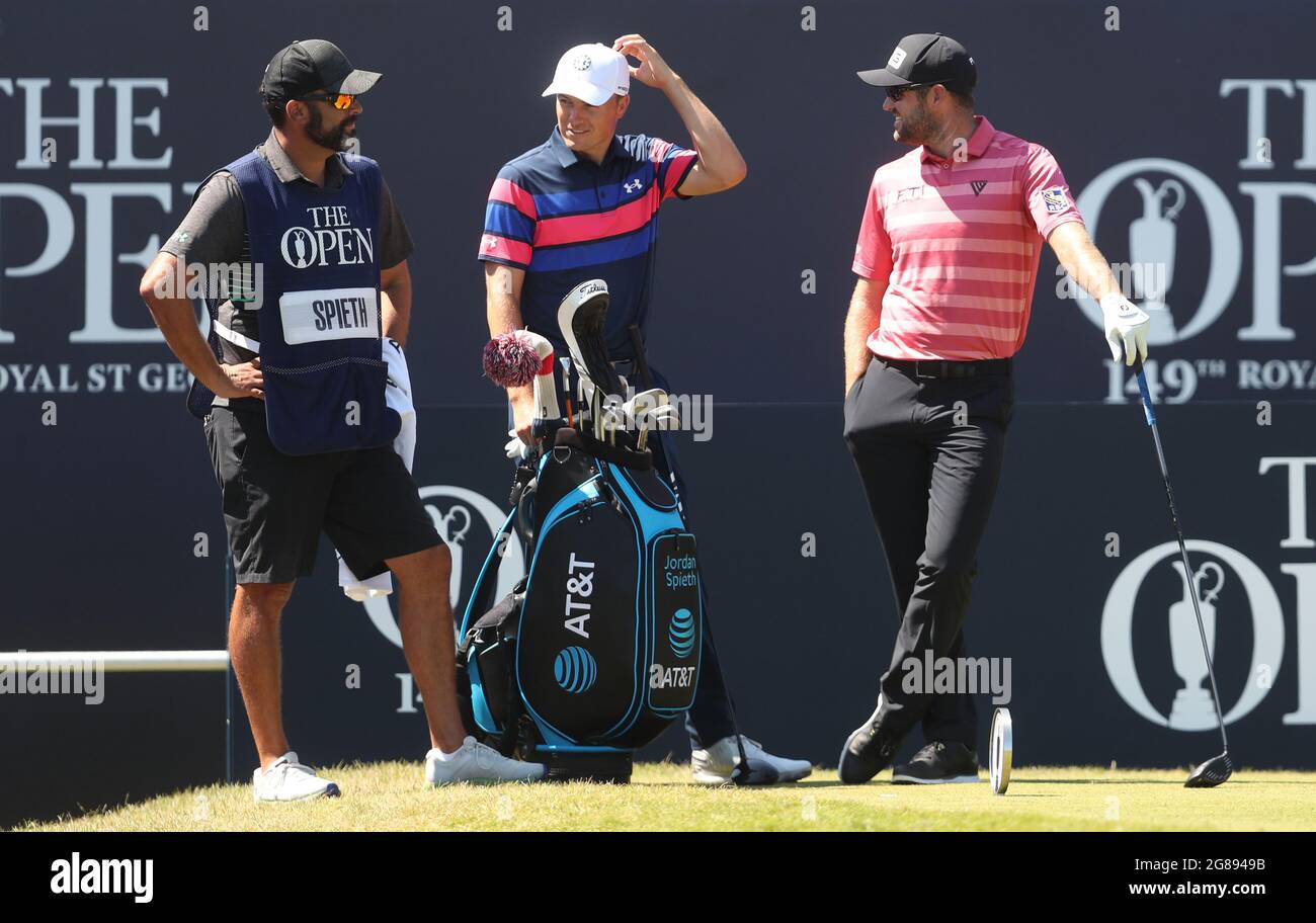 USA's Jordan Spieth (centre) and Canada's Corey Conners (right) on the 1st tee during day four of The Open at The Royal St George's Golf Club in Sandwich, Kent. Picture date: Sunday July 18, 2021. Stock Photo