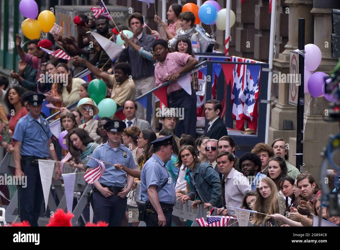 Cast during a parade scene on St Vincent Street in Glasgow city centre during filming for what is thought to be the new Indiana Jones 5 movie starring Harrison Ford. Picture date: Sunday July 18, 2021. Stock Photo