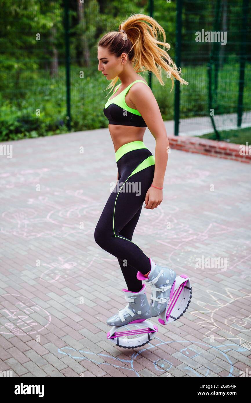 Full Length Of Woman wearing sport jump shoes. Kangaroo Jumps Stock Photo -  Alamy
