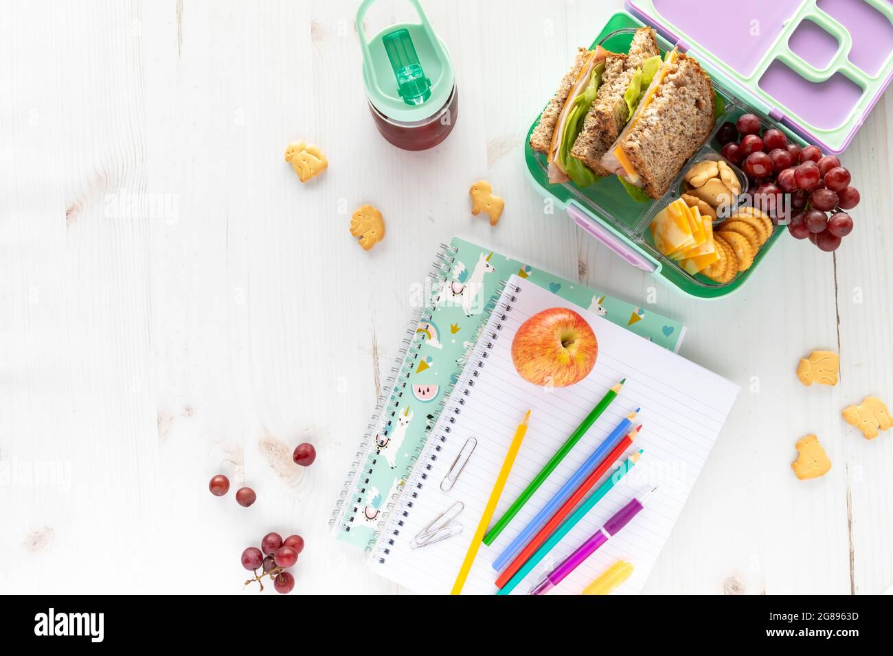 https://c8.alamy.com/comp/2G8963D/top-down-view-of-school-supplies-and-lunch-on-a-light-background-back-to-school-concept-2G8963D.jpg
