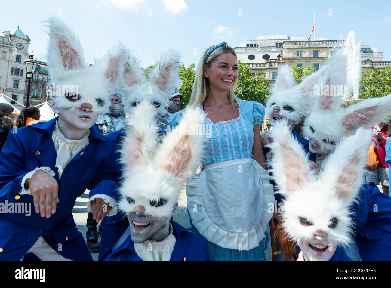 London, UK. 18 July 2021. Actors dressed as Alice (as the white queen ...