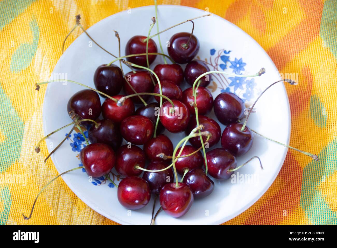 A cherry is the fruit of many plants of the genus Prunus, and is a fleshy drupe Stock Photo