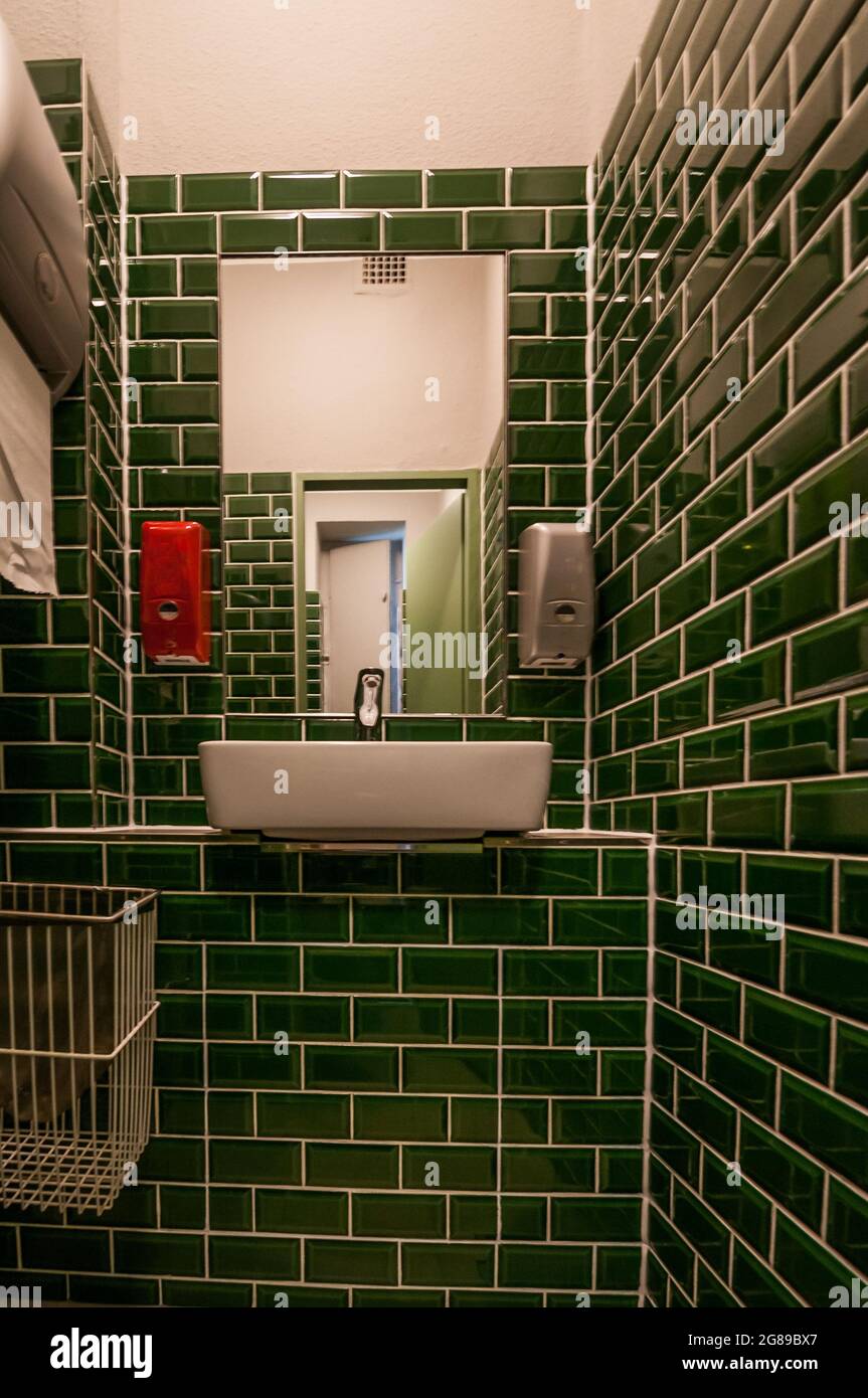 Glance into an extraordinary guest toilet. with attached washbasin. The ...
