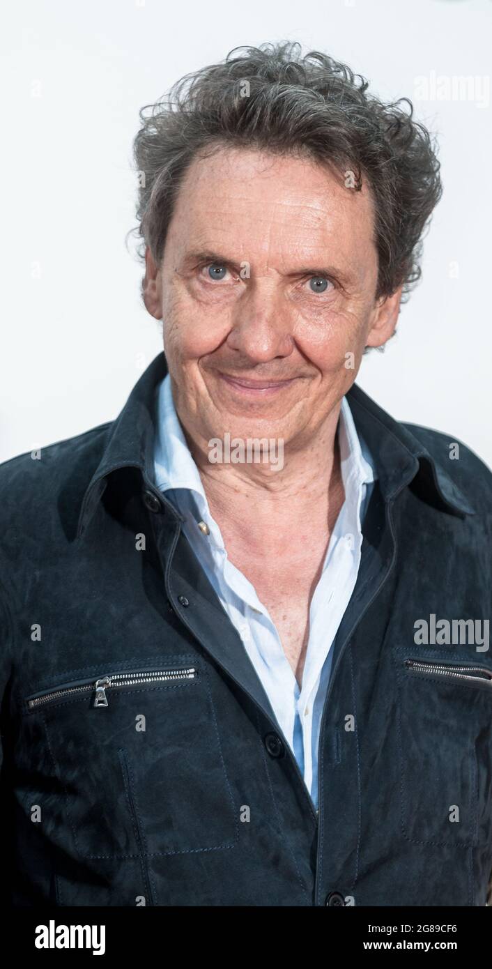 Hamburg, Germany. 18th July, 2021. Author and illustrator Erhard Dietl stands on the red carpet at the German premiere of the film 'Die Olchis - Willkommen in Schmuddelfing'. Credit: Markus Scholz/dpa/Alamy Live News Stock Photo