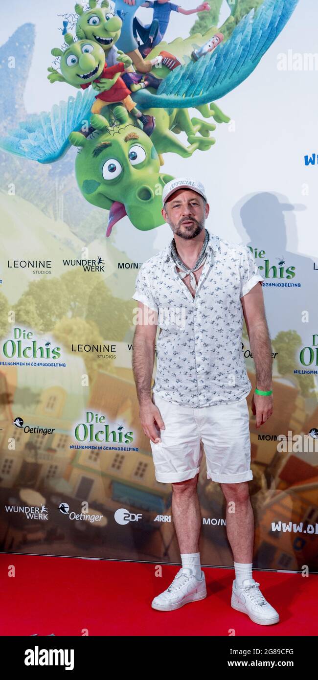 Hamburg, Germany. 18th July, 2021. Das Bo, rapper, author and interpreter of the title song, stands on the red carpet at the German premiere of the film 'Die Olchis - Willkommen in Schmuddelfing'. Credit: Markus Scholz/dpa/Alamy Live News Stock Photo