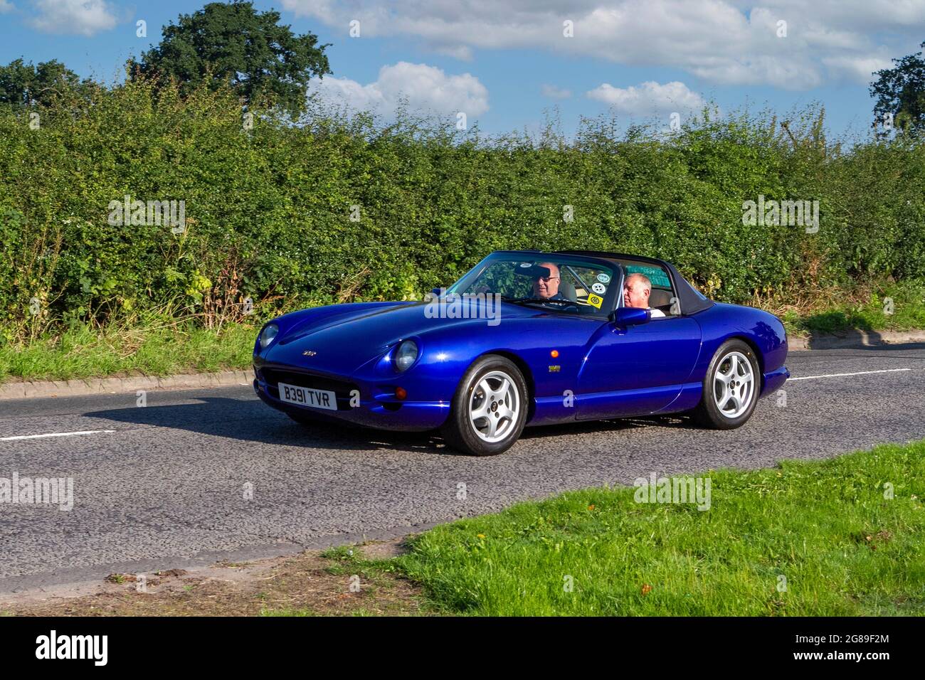 2000 blue British TVR Base 3952cc cabrio vehicle en-route to Capesthorne Hall classic July car show, Cheshire, UK Stock Photo