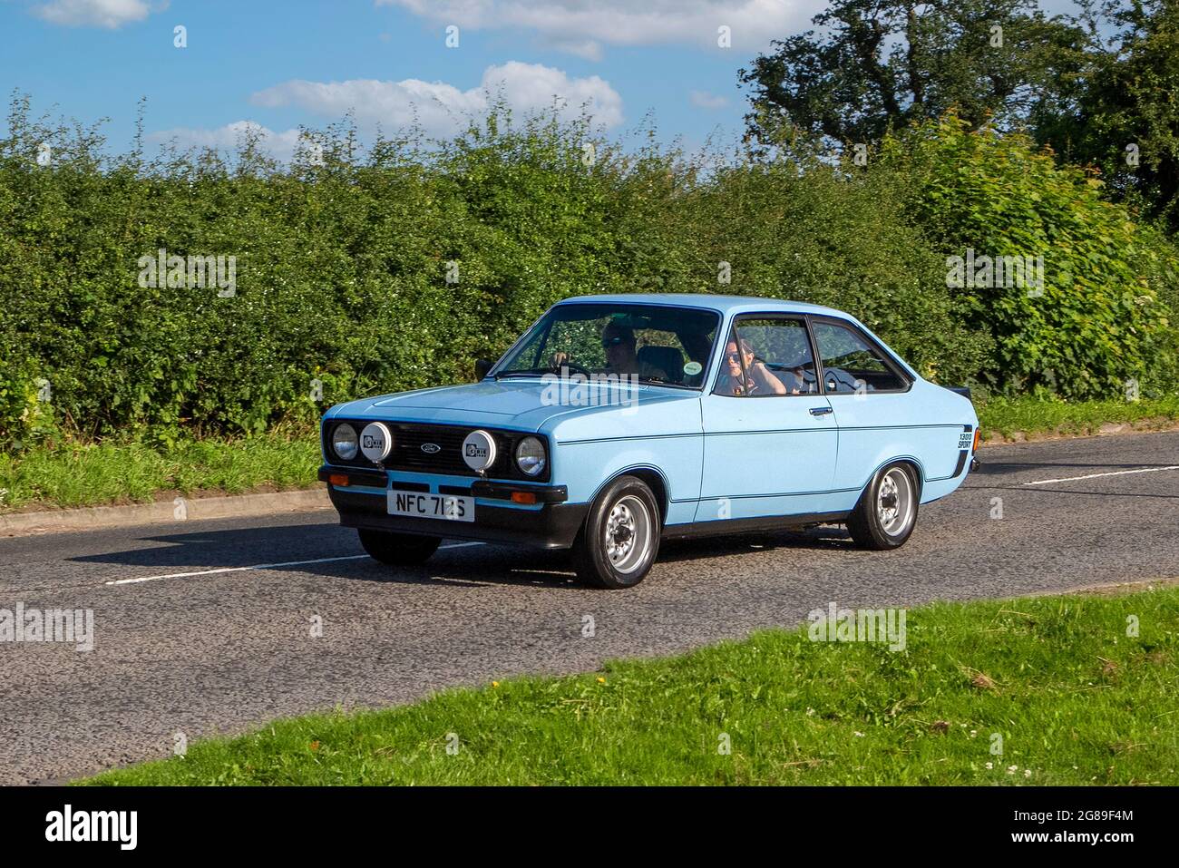 1978 70s blue Ford Escort vehicle en-route to Capesthorne Hall classic July car show, Cheshire, UK Stock Photo
