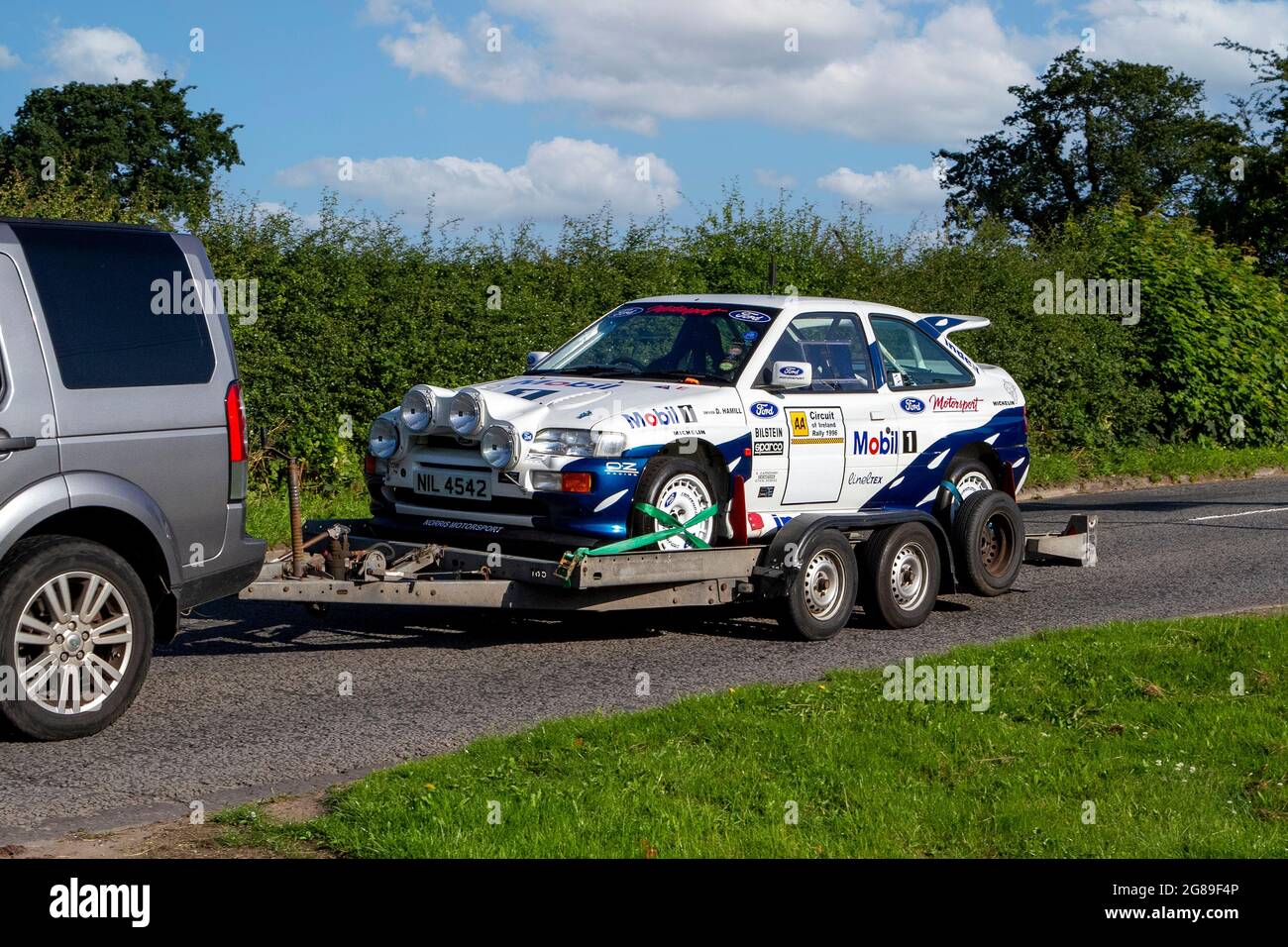 S. Earnshaw, Norris Motorsport, 1989 Ford SAPPH, racing decals, rally car, vehicle en-route to Capesthorne Hall classic July car show, Cheshire, UK Stock Photo