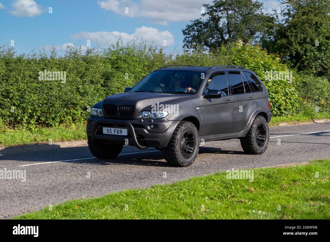 2005 black BMW IS 6 speed automatic, 4799cc petrol SUV vehicle en-route to Capesthorne Hall classic July car show, Cheshire, UK Stock Photo