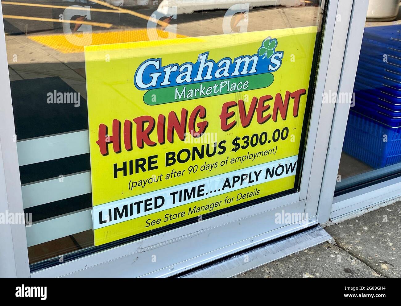 Sign at Graham's Marketplace promotes a hiring event with hire bonus. Businesses are struggling to find personnel as the pandemic eases. Stock Photo