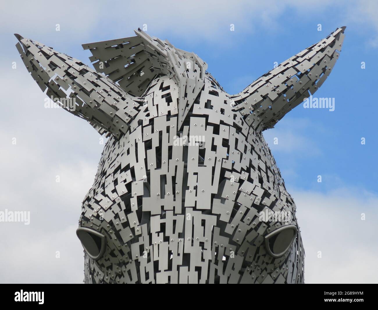 Close-up of a horse's head showing just eyes & ears: magnificent steel equine sculpture, one of The Kelpies created by sculptor Andy Scott. Stock Photo